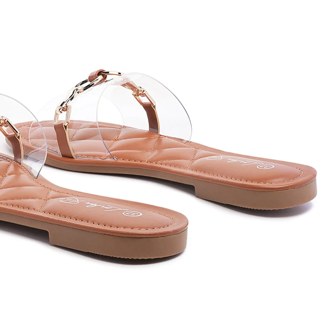 Transparent Buckled Quilted Slides in Tan